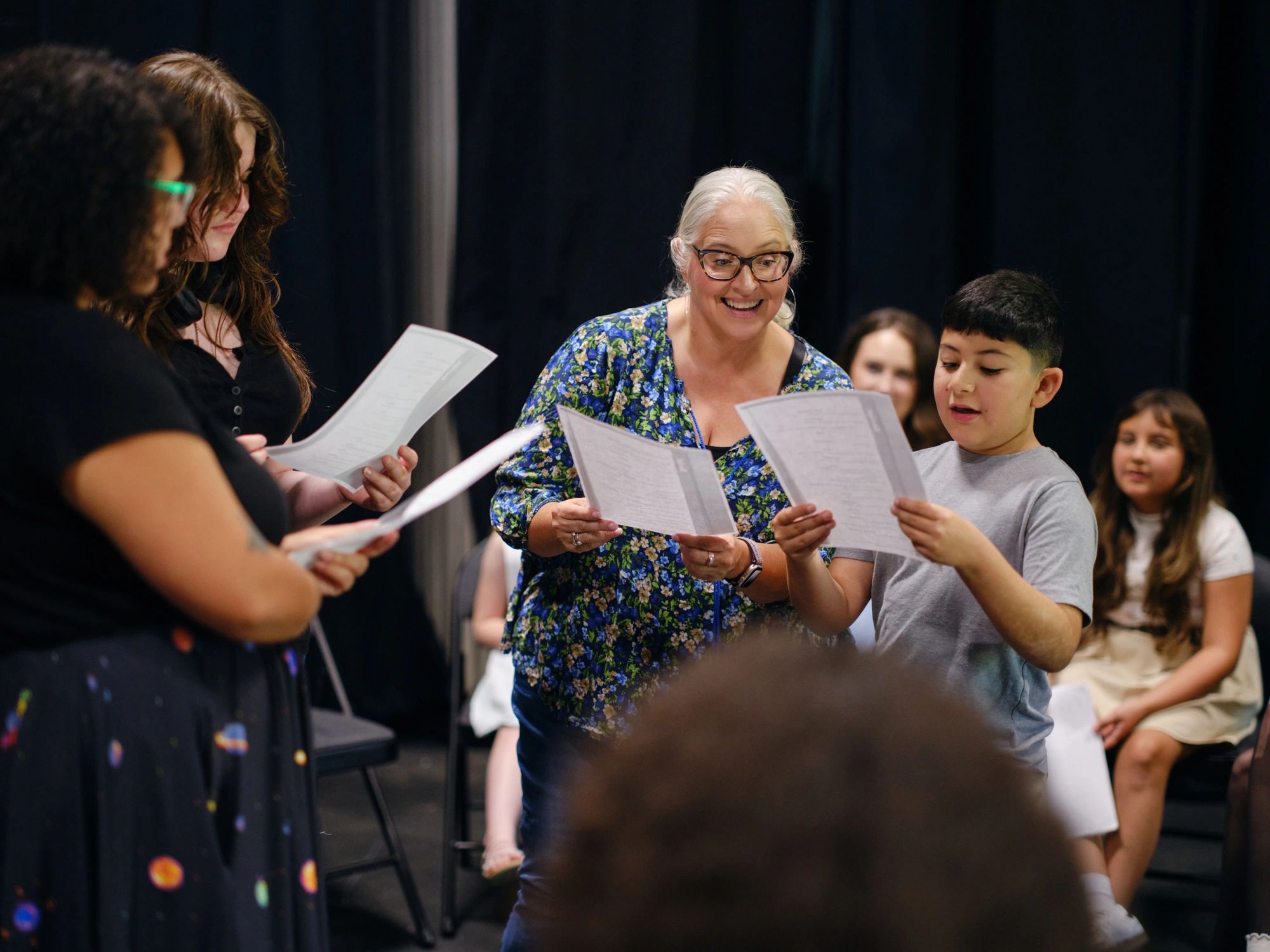 Theatre group collaborating during rehearsal