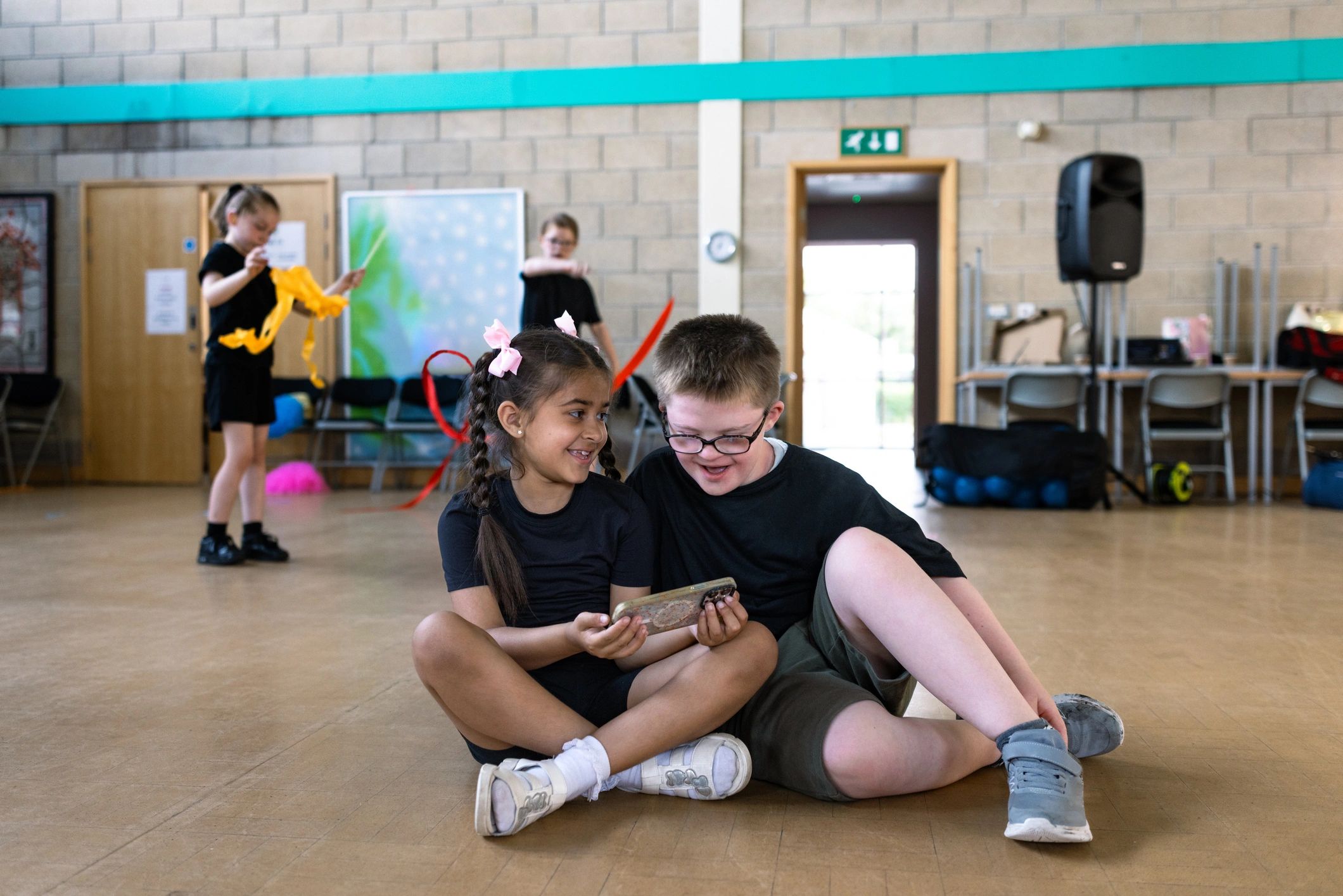 Children watching something together during a creative session